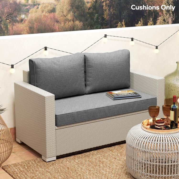 Gray loveseat cushions with two back pillows on an outdoor bench, cushions-only