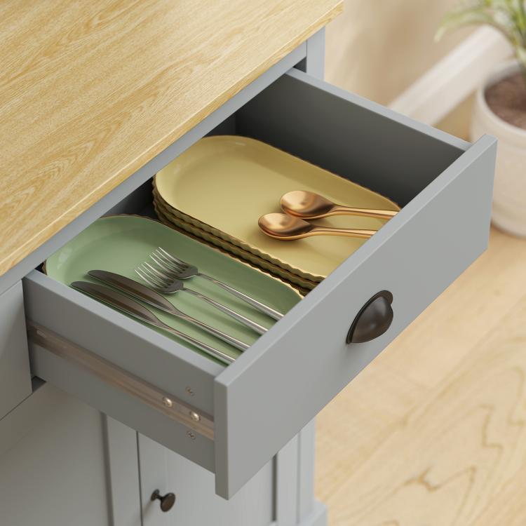 Gray freestanding kitchen cabinet with open drawer, showing utensils and plates