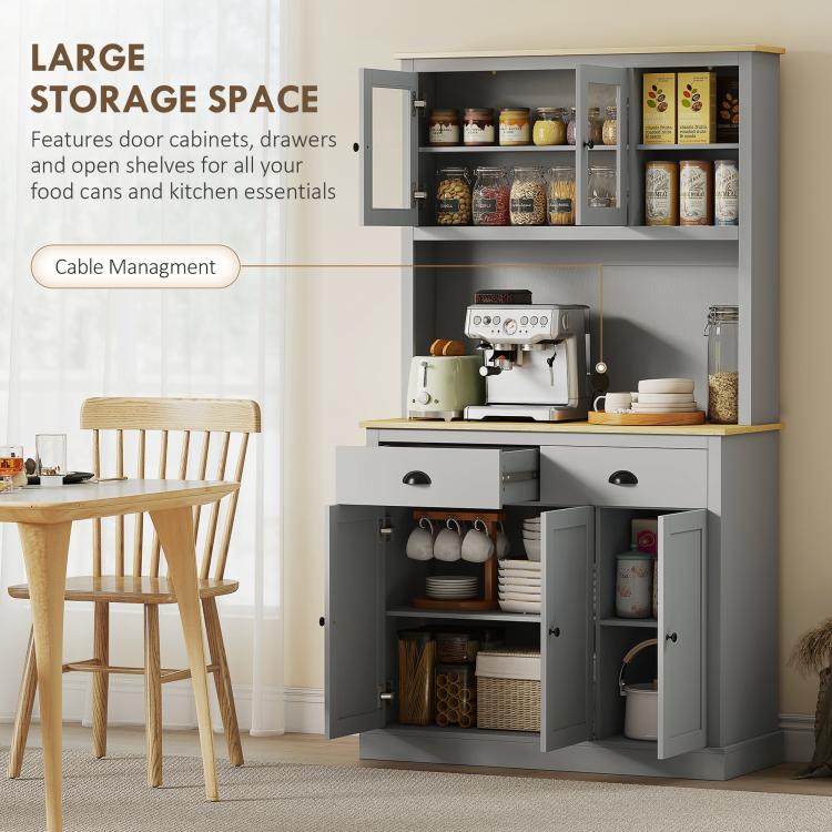 Gray kitchen pantry cabinet with multiple open shelves and enclosed lower storage doors