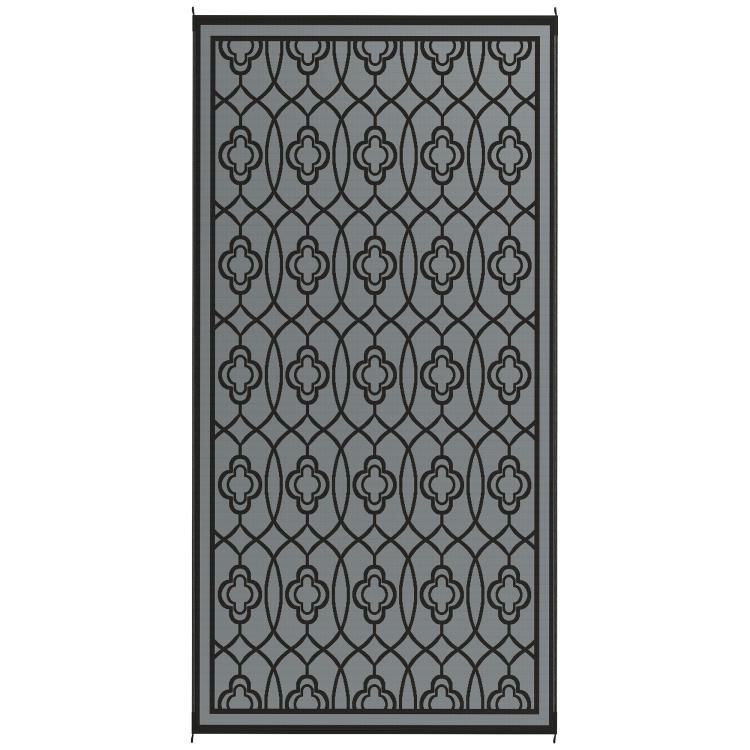 Reversible outdoor rug panel in gray with repeating quatrefoil lattice pattern
