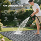 Outdoor waterproof rug with black-and-gray quatrefoil pattern on grass