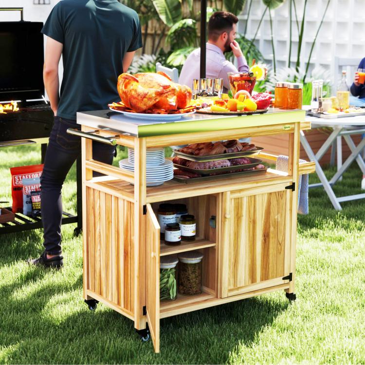 Natural wood grill cart with stainless steel cooking top, open shelves, and cabinet storage doors