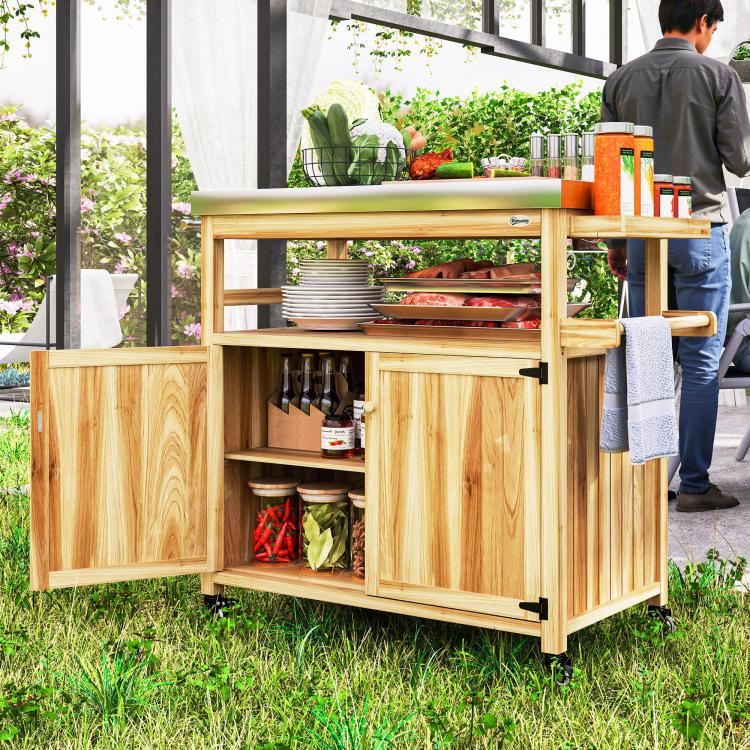 Wood outdoor kitchen island with stainless steel top, open shelf storage, and cabinet compartments