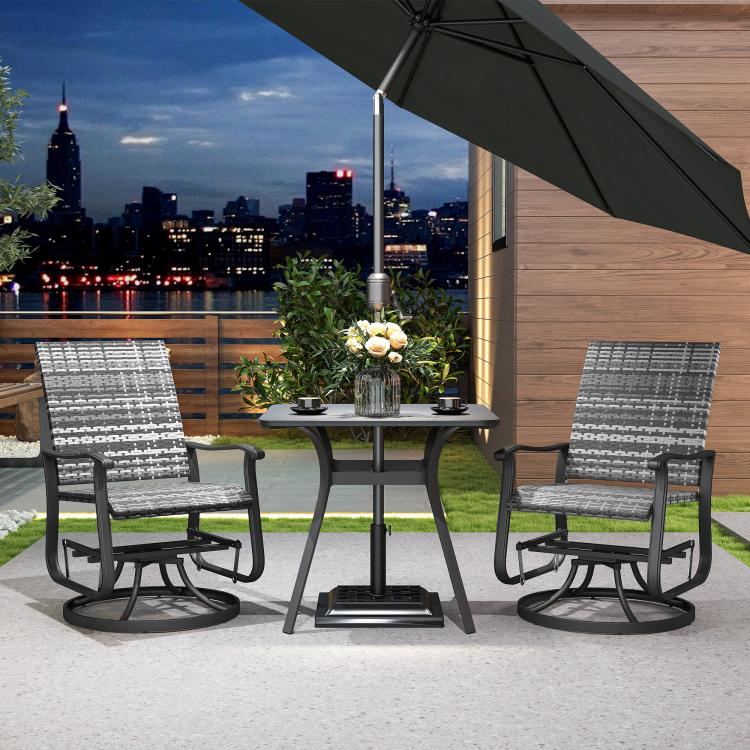 Two gray outdoor rocking glider chairs with patterned backs and armrests near patio table