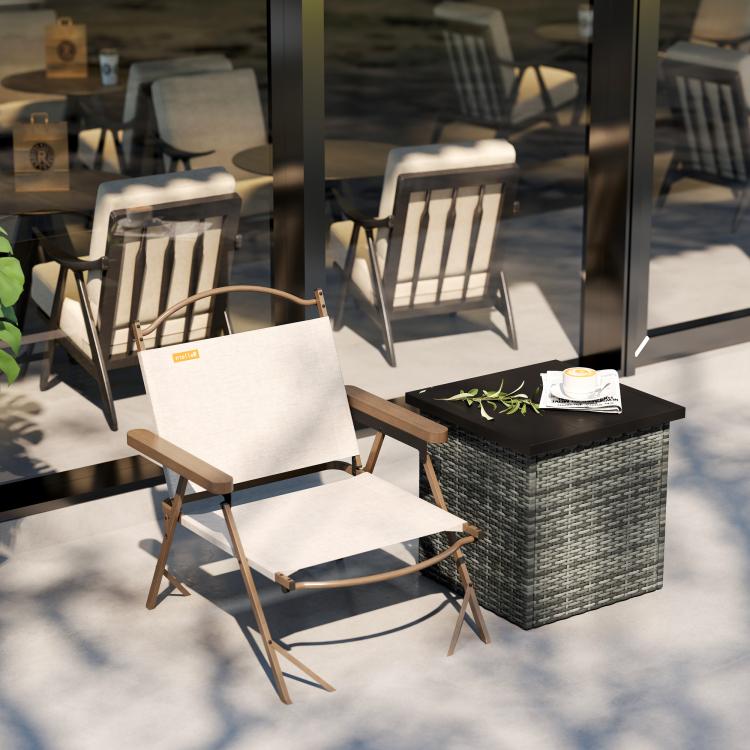Square outdoor side table with woven gray wicker frame and dark tabletop