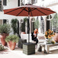 Woven wicker outdoor side table with dark top used beside patio seating.