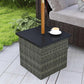 Mixed-gray wicker outdoor side table with dark top and coffee cup on surface.