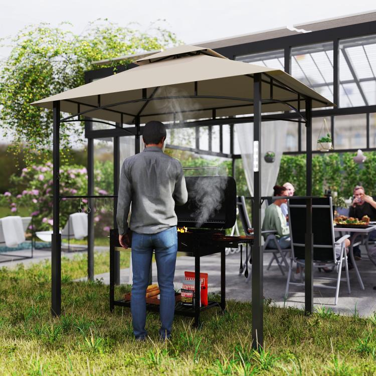 Outdoor grill gazebo shelter with khaki canopy and black metal frame over grill