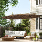 Khaki patio umbrella open over outdoor sofa seating near the house