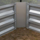Raised metal planter box, white panels with silver posts and bolts, open end view