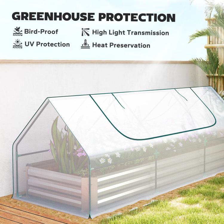 Transparent mini greenhouse cover over white raised planter bed with black frame