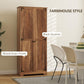 Brown farmhouse pantry cabinet with black accents and front door detail