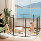 Black 8-panel metal dog playpen indoors, arched top, dog lying inside