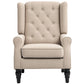 Beige wingback accent chair with button-tufted back and rolled armrests on dark legs