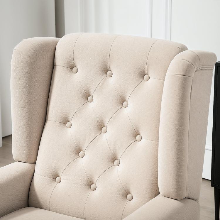 Beige wingback accent chair with button-tufted back and rounded armrests, fabric upholstery