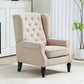 Beige upholstered wingback accent chair with button-tufted back and rolled armrests
