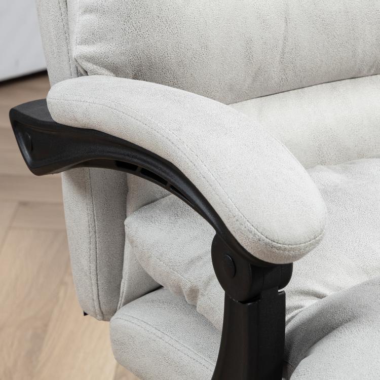 Close-up of light gray reclining chair armrest and padded seat for massage comfort