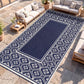 Blue-and-white outdoor rug with central navy panel and floral gourd border