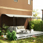 Cream white pergola canopy shading an outdoor lounge on black metal framework