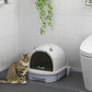 Covered cat litter box in gray and white with closed lid and dark privacy panel
