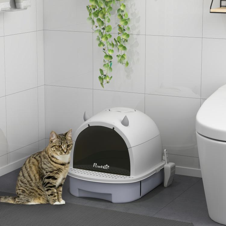 Covered cat litter box in gray and white with closed lid and dark privacy panel