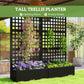 Black raised trellis planter with climbing plants and purple blossoms