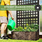 Black raised planter box with trellis and drainage opening at the base