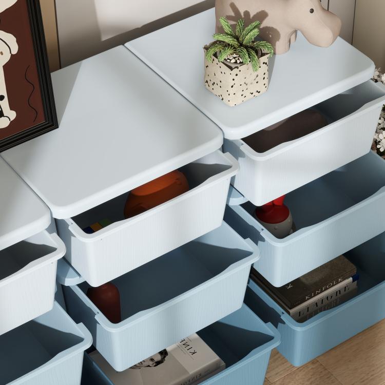 Close-up of light blue storage dresser drawers with open bins and corner supports