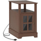 Brown narrow end table with open shelf, cabinet doors, and power cable connection