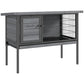 Gray elevated wooden small animal hutch with front door and wire mesh