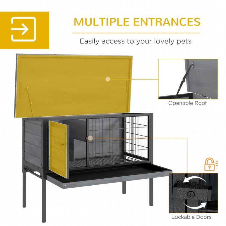 Gray elevated wooden rabbit hutch with wire enclosure, multiple access doors and open roof