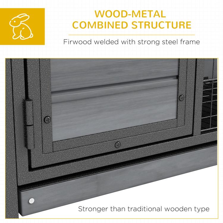 Wood-metal structure detail on gray rabbit hutch frame with welded steel edges