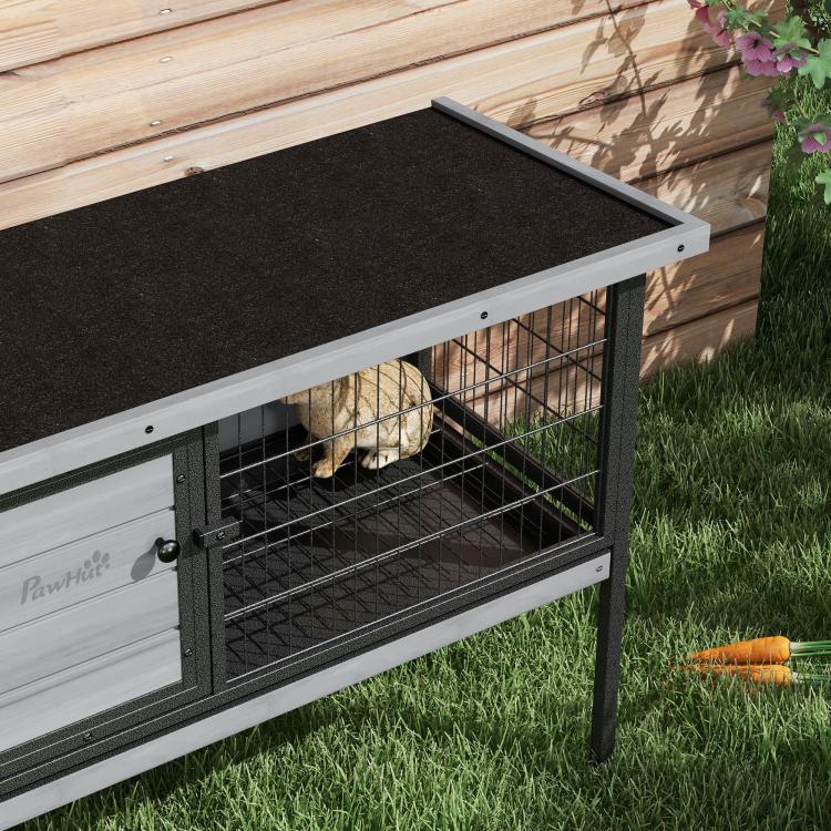 Gray elevated rabbit hutch with open top panel above wire mesh, rabbit inside