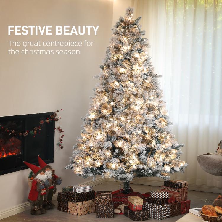 Flocked prelit artificial Christmas tree with warm clear lights and full branches