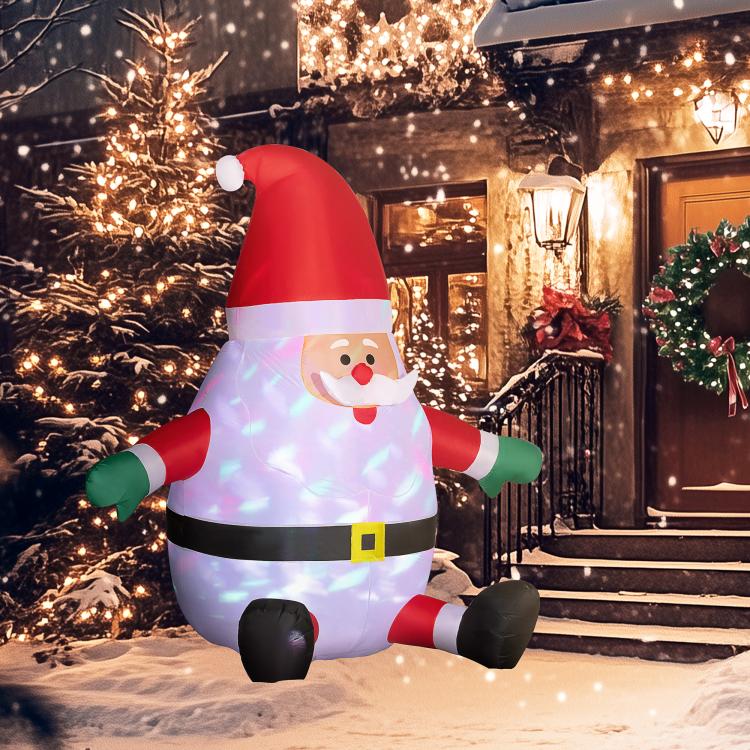 Inflatable Santa decoration with glowing suit lights and red hat outdoors at night