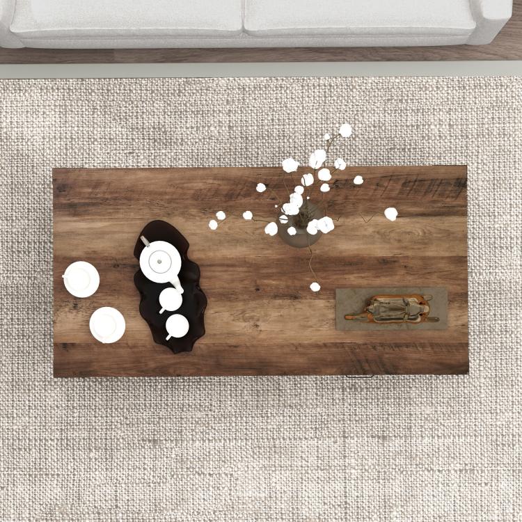 Wood tabletop with dark storage door and retro handle on a gray coffee table