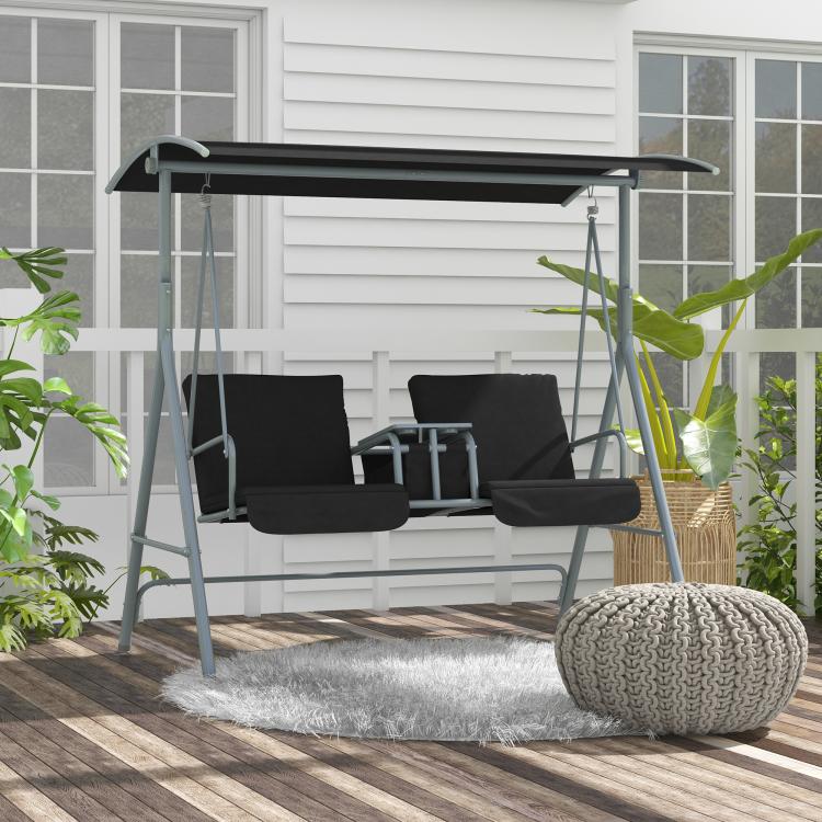 Canopied two-seat swing chair with black cushions and gray frame on patio