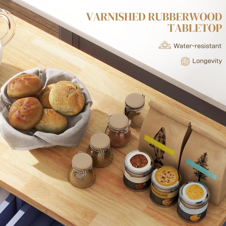 Rubberwood tabletop on navy kitchen island cart with spice jars and small containers