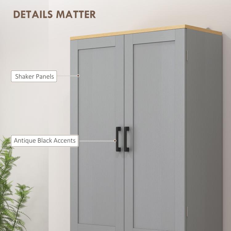 Gray pantry cabinet doors with shaker-style panels and antique black bar handles