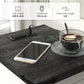 End table top charging panel with AC outlets and USB ports, plus phone and power cord