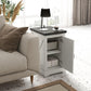 White end table with black top and open storage compartment behind front cabinet doors