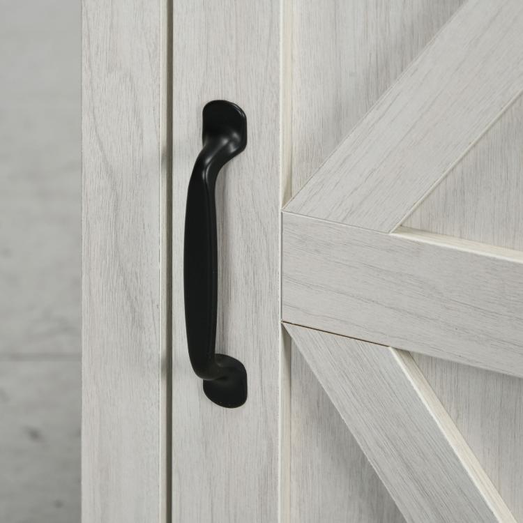 Close-up of black bar handle on white distressed cabinet door of the end table
