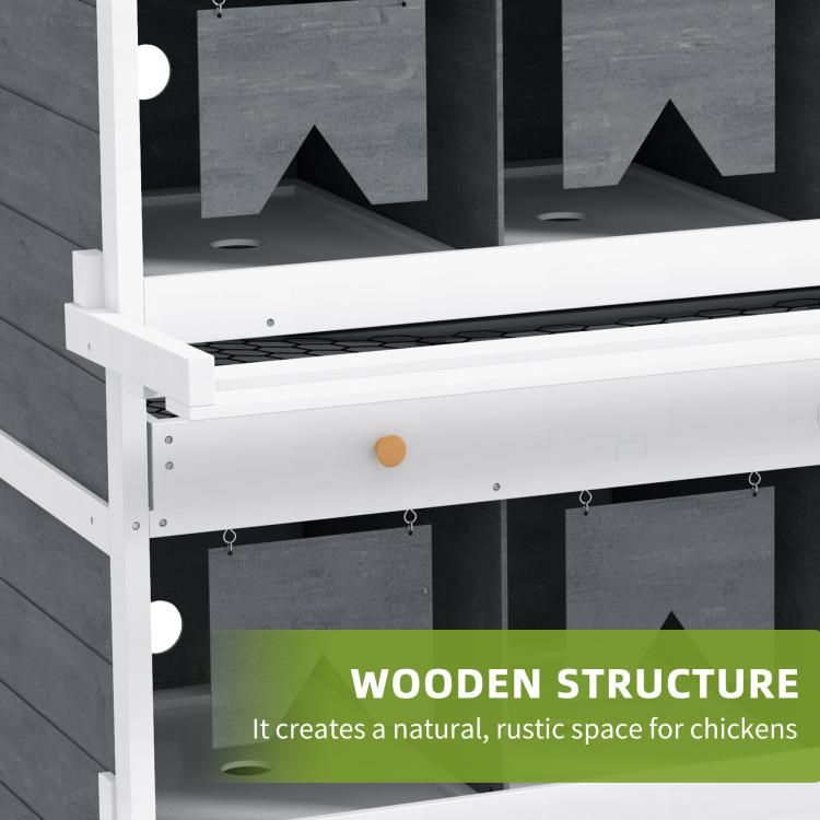 Close-up of white wooden nesting box frame with dark compartment inserts on two levels