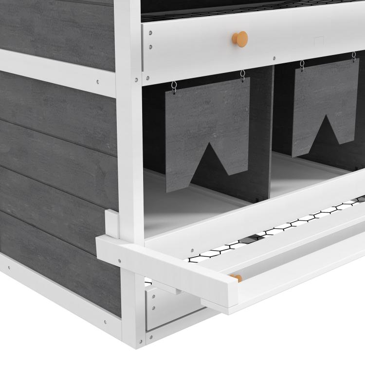 Close-up of white nesting box interior with dark compartment panels and hanging curtain openings