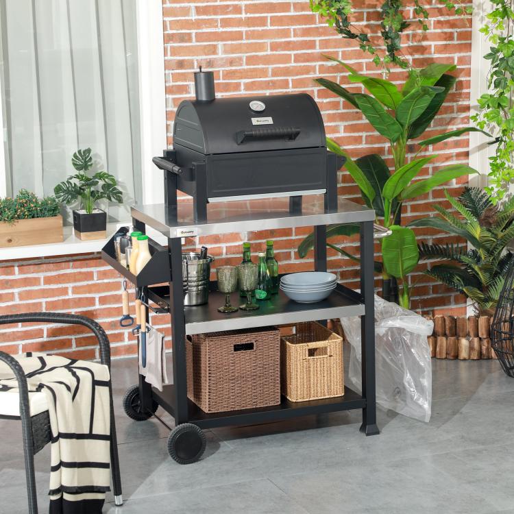 Black barbecue cart with stainless top, three tiers, and front wheels for easy movement