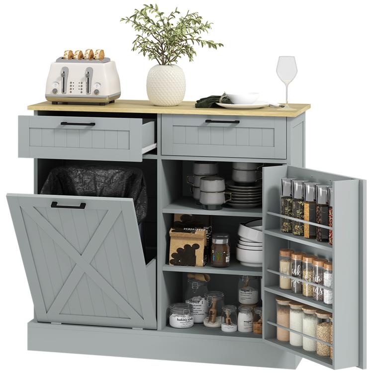 Gray farmhouse kitchen cabinet with tilt-out hidden trash can and two drawers, open storage doors.