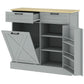 Gray farmhouse kitchen cabinet with two drawers and tilt-out trash door open, interior shelves