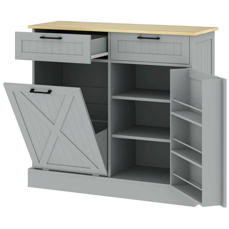 Gray farmhouse kitchen cabinet with two drawers and tilt-out trash door open, interior shelves