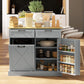 Gray hidden-trash kitchen cabinet with barn-style door, open shelves for jars and canisters.