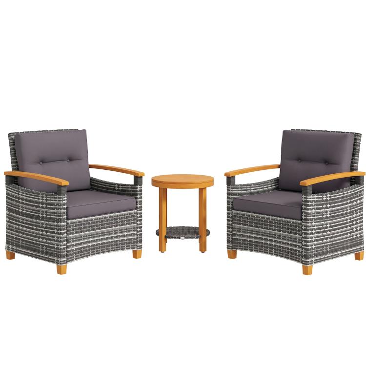 Outdoor bistro set: two gray cushioned wicker armchairs and round wood side table